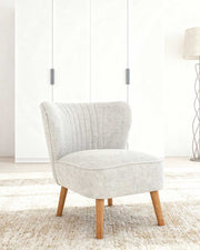 Sillón tapizado en tela Eve